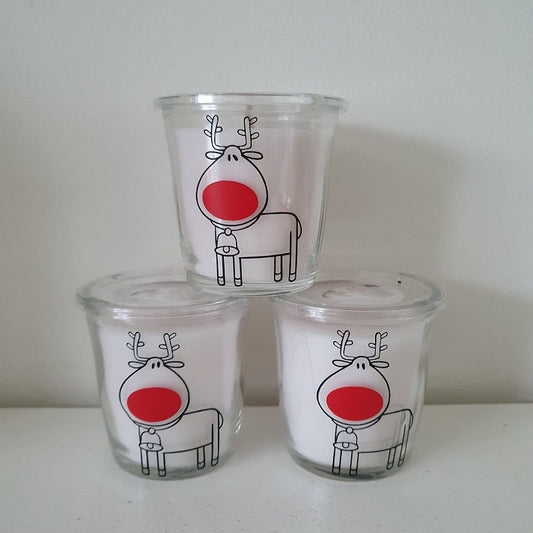 Rudolf geurkaarsen set: drie geurkaarsen in glas met een getekend rendier met rode neus, FlexMade
